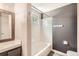 Updated bathroom features tile shower with bathtub, gray vanity, and modern fixtures at 13265 Raritan St, Denver, CO 80234