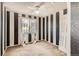 Bedroom with black and white striped accent walls, ceiling fan and large window at 13265 Raritan St, Denver, CO 80234