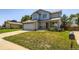 Inviting two-story home with a front porch and a spacious front yard at 13265 Raritan St, Denver, CO 80234