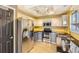 Well-equipped kitchen featuring modern appliances, light cabinets, and dark countertops at 13265 Raritan St, Denver, CO 80234