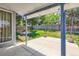 Covered patio area overlooking the grassy backyard with a wood fence at 13265 Raritan St, Denver, CO 80234