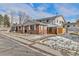 Charming brick townhouse exterior with well-maintained lawn, inviting curb appeal, and a glimpse of neighborhood charm at 9886 Appletree Pl, Thornton, CO 80260