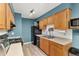 Efficient kitchen with updated appliances, ample counter space, and sleek black appliances, great for cooking at 9886 Appletree Pl, Thornton, CO 80260