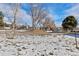 Scenic view of a neighborhood, showing snow-covered ground and tree lined streets at 9886 Appletree Pl, Thornton, CO 80260