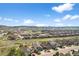 Stunning aerial view showcasing the community, nearby mountains, and blue skies at 3429 Goodyear St, Castle Rock, CO 80109