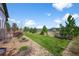 Beautiful backyard featuring a spacious lawn and professional landscaping at 3429 Goodyear St, Castle Rock, CO 80109
