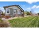 Beautiful backyard featuring a spacious lawn and professional landscaping at 3429 Goodyear St, Castle Rock, CO 80109
