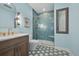 Stylish bathroom featuring a glass-enclosed shower and a vanity with a marble countertop at 3429 Goodyear St, Castle Rock, CO 80109