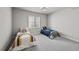 Bright bedroom features two twin beds, a window, and soft gray carpet at 3429 Goodyear St, Castle Rock, CO 80109