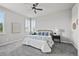 This bedroom features a ceiling fan, neutral walls, and windows with white shutters that let in plenty of natural light at 3429 Goodyear St, Castle Rock, CO 80109