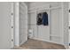 Walk-in closet with built in shelving and hanging rods at 3429 Goodyear St, Castle Rock, CO 80109