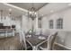 Spacious dining room with wood floors, open to the kitchen, perfect for entertaining at 3429 Goodyear St, Castle Rock, CO 80109