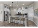 Modern kitchen featuring stainless steel appliances, granite countertops, and breakfast bar at 3429 Goodyear St, Castle Rock, CO 80109