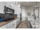 Modern kitchen features stainless steel appliances, a gas cooktop, and a farmhouse sink at 3429 Goodyear St, Castle Rock, CO 80109