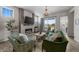 Cozy living room with a fireplace, comfortable seating, and plenty of natural light at 3429 Goodyear St, Castle Rock, CO 80109