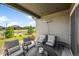 Covered outdoor patio with comfortable seating and neighborhood views at 3429 Goodyear St, Castle Rock, CO 80109