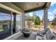 Relaxing covered patio area with comfortable seating and views of the landscaped yard at 3429 Goodyear St, Castle Rock, CO 80109