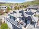 This stunning home features solar panels, a rooftop terrace, hot tub, patio seating, and beautiful mountain views at 2136 S Juniper St, Lakewood, CO 80228