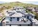 This stunning home features solar panels, a rooftop terrace, hot tub, patio seating, and beautiful mountain views at 2136 S Juniper St, Lakewood, CO 80228