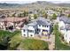 This stunning home features solar panels, a rooftop terrace, a large backyard, and beautiful mountain views at 2136 S Juniper St, Lakewood, CO 80228
