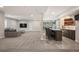 Finished basement with stylish bar area including seating, modern cabinets and a glass wine cellar at 2136 S Juniper St, Lakewood, CO 80228