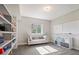 Well lit bonus room features carpeted floors, bright windows, a neutral color palette, and built in shelving at 2136 S Juniper St, Lakewood, CO 80228
