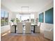 Elegant dining room with contemporary lighting and large windows at 2136 S Juniper St, Lakewood, CO 80228