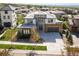 This beautiful home features mature landscaping, an attached two-car garage, a stone facade, and an inviting entrance at 2136 S Juniper St, Lakewood, CO 80228