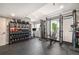 Finished basement home gym with weight racks, exercise equipment, and rubber flooring at 2136 S Juniper St, Lakewood, CO 80228