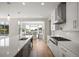 Kitchen with stainless appliances, ample counter space, and a view to the dining area at 2136 S Juniper St, Lakewood, CO 80228