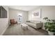 Cozy living room with comfortable seating and art, with access to a private patio at 2136 S Juniper St, Lakewood, CO 80228