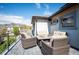 Outdoor patio with comfortable seating and a firepit table, great for relaxing and entertaining at 2136 S Juniper St, Lakewood, CO 80228