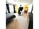 Bedroom with carpeted floor, large window and walk-in closet at 7435 E 159Th Pl, Thornton, CO 80602