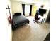 Bedroom with carpeted floor, large window and computer setup at 7435 E 159Th Pl, Thornton, CO 80602
