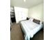Well-lit bedroom featuring a queen bed, double door closet, and neutral decor throughout at 7435 E 159Th Pl, Thornton, CO 80602