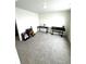 Bedroom with carpeted floor, large desk and guitar at 7435 E 159Th Pl, Thornton, CO 80602