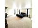 Expansive bedroom featuring a large bed, neutral carpet, and ambient natural light at 7435 E 159Th Pl, Thornton, CO 80602