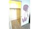 Small walk-in closet with a single hanging rack and storage space at 7435 E 159Th Pl, Thornton, CO 80602