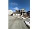 Beautiful two-story home with a three car garage and stone accents on a sunny day at 7435 E 159Th Pl, Thornton, CO 80602