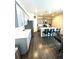 Charming kitchen featuring an eat-in island, stainless steel appliances, and light grey cabinets at 7435 E 159Th Pl, Thornton, CO 80602