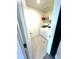 Functional laundry room with a modern washer and dryer set and ample storage space on the overhead shelving at 7435 E 159Th Pl, Thornton, CO 80602