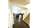 Inviting living room with hardwood floors, comfortable seating, and staircase at 7435 E 159Th Pl, Thornton, CO 80602