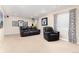 Finished basement featuring comfortable seating, neutral carpet and a mounted flat screen TV at 9170 Fox Fire Dr, Highlands Ranch, CO 80129