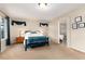 Relaxing bedroom featuring bright windows, bedside tables and Primary bath walkthrough at 9170 Fox Fire Dr, Highlands Ranch, CO 80129
