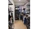 Neatly organized closet with hanging rods, shelves, and storage bins for optimal storage at 9170 Fox Fire Dr, Highlands Ranch, CO 80129