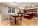 Light filled dining area adjacent to kitchen boasts recessed lighting at 9170 Fox Fire Dr, Highlands Ranch, CO 80129
