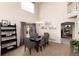Dining room featuring high ceilings, modern decor, and plenty of natural light at 9170 Fox Fire Dr, Highlands Ranch, CO 80129