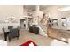 Bright entryway with staircase, wood floors, and sight lines to dining and living room at 9170 Fox Fire Dr, Highlands Ranch, CO 80129