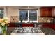 Close-up of kitchen features granite countertops, stainless appliances and stylish backsplash at 9170 Fox Fire Dr, Highlands Ranch, CO 80129