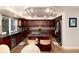 Spacious kitchen with wood cabinets, granite countertops, and a large island at 9170 Fox Fire Dr, Highlands Ranch, CO 80129